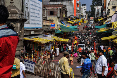 People on street market in city