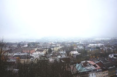 Aerial view of crowd in city against sky