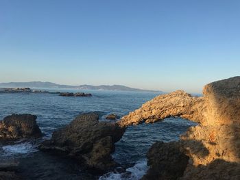 Scenic view of sea against clear sky