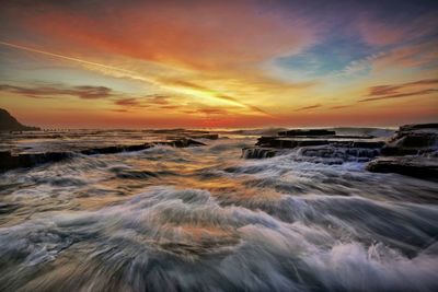 Scenic view of sea against sky during sunset