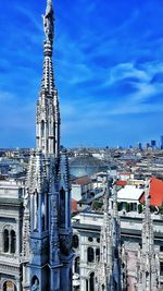 High angle view of city against cloudy sky