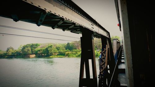 Bridge over river against sky