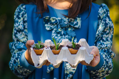 Midsection of woman holding ice cream