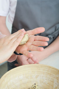 Midsection of man preparing food