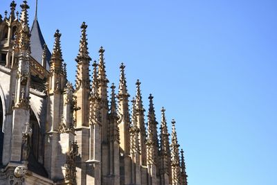 Low angle view of building against clear blue sky