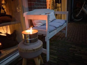 Close-up of illuminated candles on table