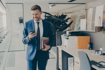 Portrait of businessman using mobile phone