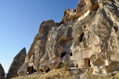 Low angle view of rocks against sky