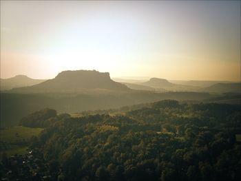 Scenic view of mountains against sky at sunset