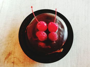 High angle view of strawberries in plate on table