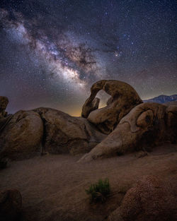 Milky way behind natural arch