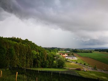 Scenic view of landscape against cloudy sky