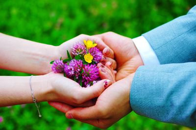 Close-up of couple holding hands