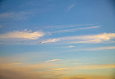 Low angle view of airplane flying in sky