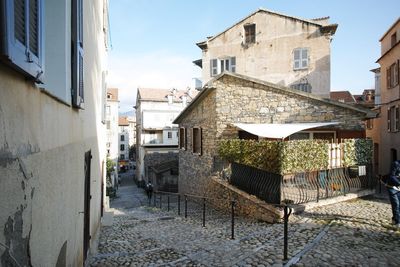 Narrow street amidst buildings in town