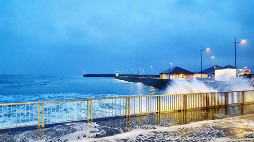 Scenic view of sea against blue sky during winter