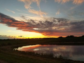 Scenic view of lake against sky during sunset