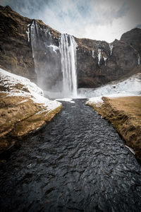 Scenic view of waterfall during winter