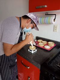 Man preparing food in kitchen