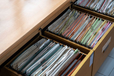 High angle view of files in drawers