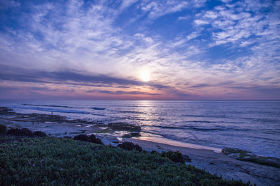 Scenic view of sea against cloudy sky