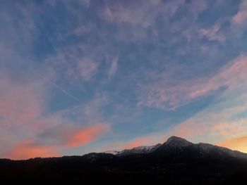 Scenic view of silhouette mountains against sky during sunset