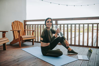 Woman sitting on chair at table