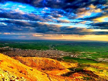 Scenic view of landscape against cloudy sky