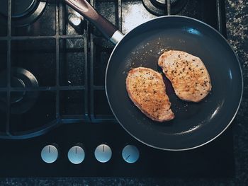 Directly above shot of meat cooking in pan