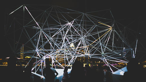 Ferris wheel against sky at night