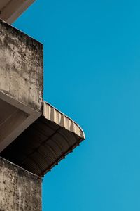 Low angle view of building against clear blue sky