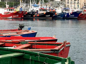 Boats moored at harbor