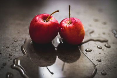 Close-up of two apples on table