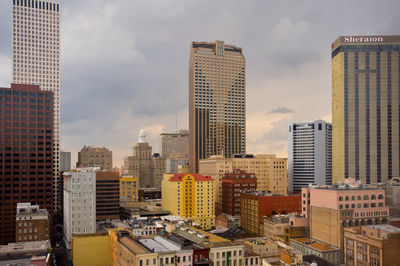 Modern buildings in city against sky