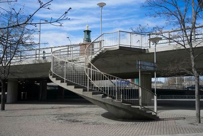 Empty road with buildings in background