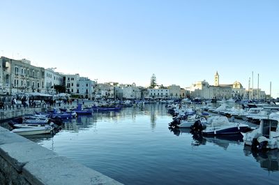 Boats moored at harbor