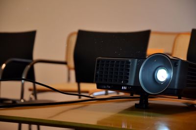 Close-up of projection equipment on table