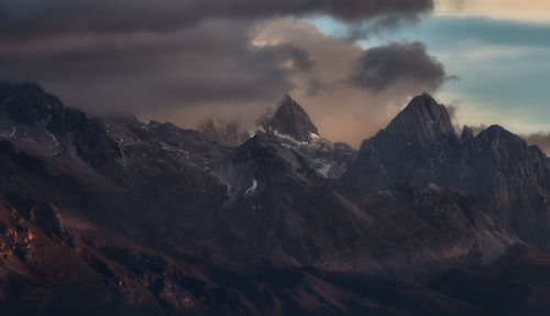 Scenic view of snowcapped mountains against sky