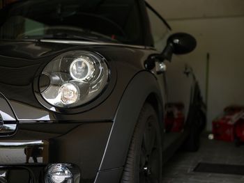 Black car parked in garage