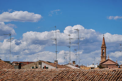 Buildings in city against sky