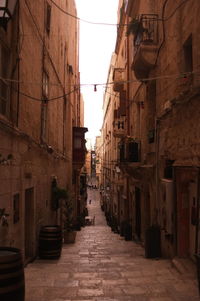 Narrow alley amidst buildings in city