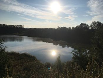 Scenic view of calm lake at sunset