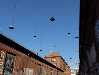 Low angle view of lighting equipments hanging