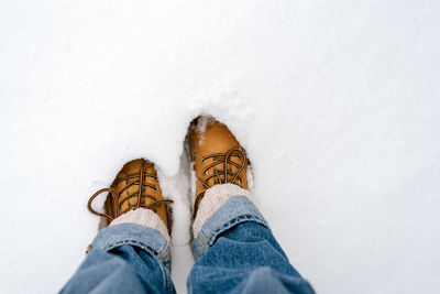 Boots in the snow, top view.