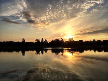 Scenic view of lake at sunset