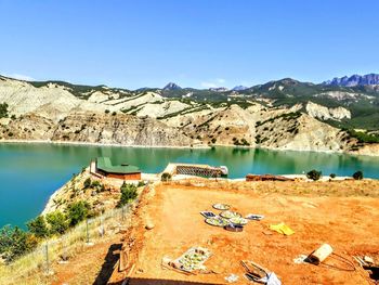 Scenic view of lake against clear blue sky