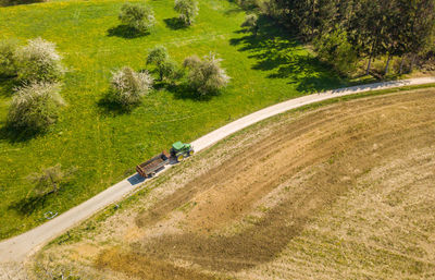 High angle view of tire tracks on road