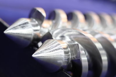 Close-up of metallic object over black background