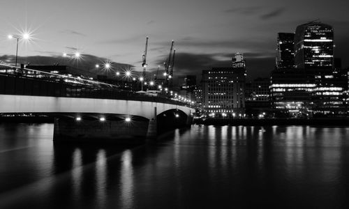 Reflection of illuminated buildings in water at night