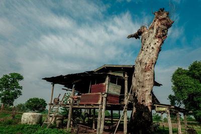 Low angle view of old abandoned building against sky